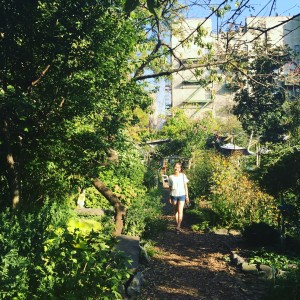 Anqi Peng poses in the Ninth Street Community Garden