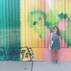Mariel Vaca-Cruz poses in front of graffiti in Bushwick